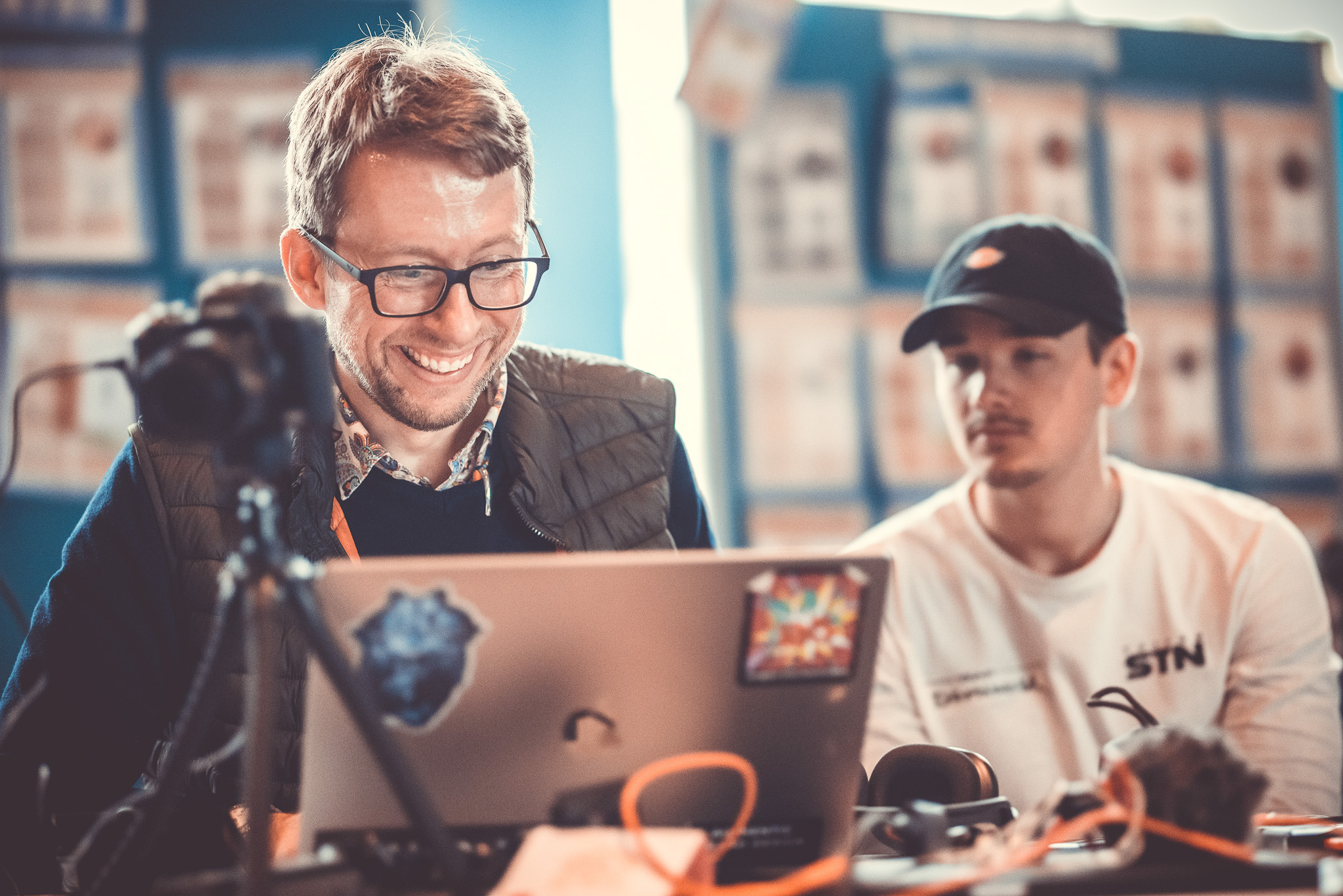 Daniel Schwenger smiling at the streaming laptop